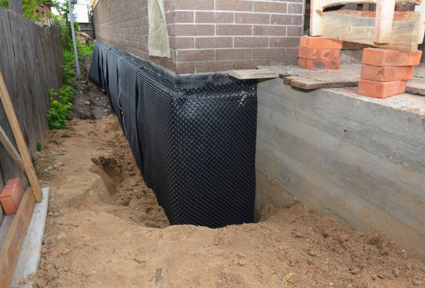 SJ Waterproofing Pros technician performing targeted Exterior Waterproofing assessment in Madison, VA